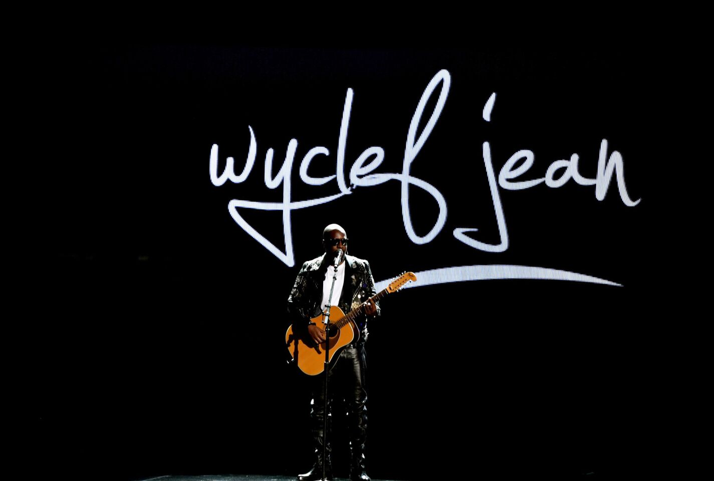 Wyclef Jean presents a reggae performance.