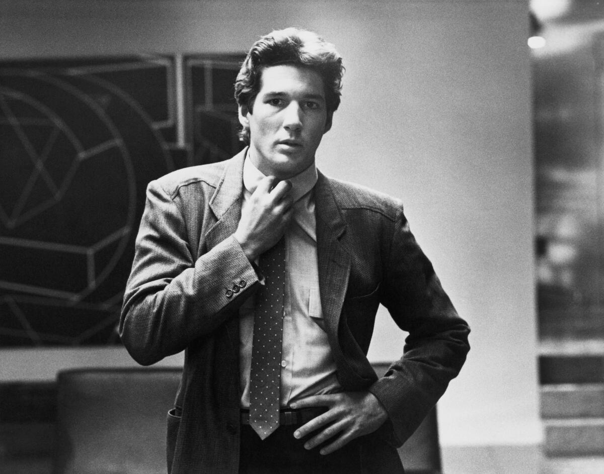 Black and white photo of Richard Gere wearing a Giorgio Armani blazer in the 1980 film “American Gigolo”