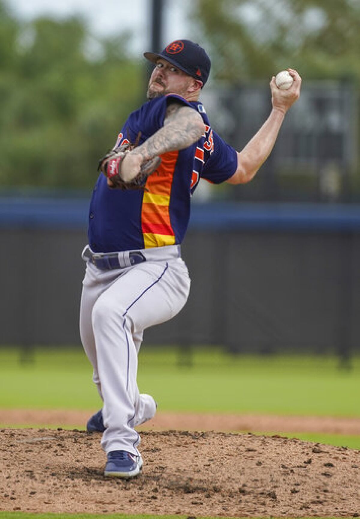 Houston Astros pitcher Ryan Pressly pitches during a minor league game against the Washington Nationals minor leaguers on the back fields at The Ballpark of the Palm Beaches facility on Thursday, March 24, 2022 in West Palm Beach, Fla. (Karen Warren/Houston Chronicle via AP)