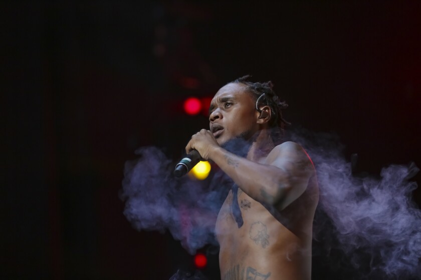 FILE - Rapper Slim Jxmmi, of Rae Sremmurd, performs on stage during the Dazed and Blazed Summer 2018 Tour at Jiffy Lube Live on Thursday, Aug. 9, 2018, in Bristow, Va. Rapper Slim Jxmmi was arrested in Miami early Tuesday, Jan. 25, 2022, after attacking the mother of his young child during an argument, police said. Aaquil Brown, who performs under the name Slim Jxmmi in the hip hop duo Rae Sremmurd, faces a misdemeanor battery charge. (Photo by Brent N. Clarke/Invision/AP, File)