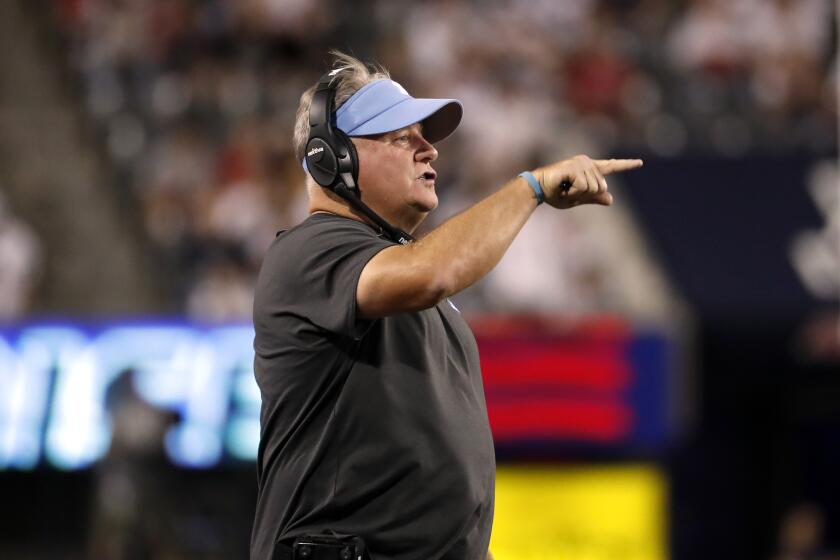 UCLA coach Chip Kelly gestures during the first half of the team's NCAA college football game.