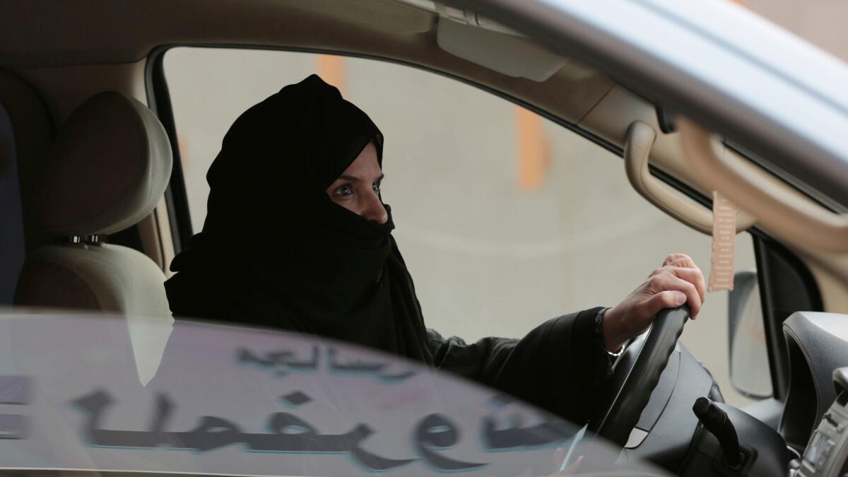 Aziza Yousef takes the wheel in Riyadh during a 2014 campaign to defy Saudi Arabia's ban on women driving.