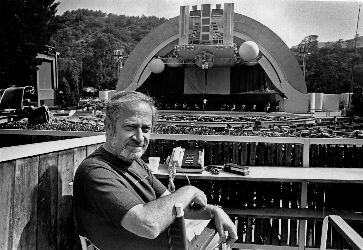 black and white photo of a man in front of the Hollywood Bowl in 1984.