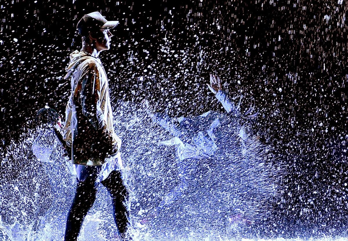 Justin Bieber performs, in a lot of water, during the American Music Awards finale during the 2015 American Music Awards at Microsoft Theater
