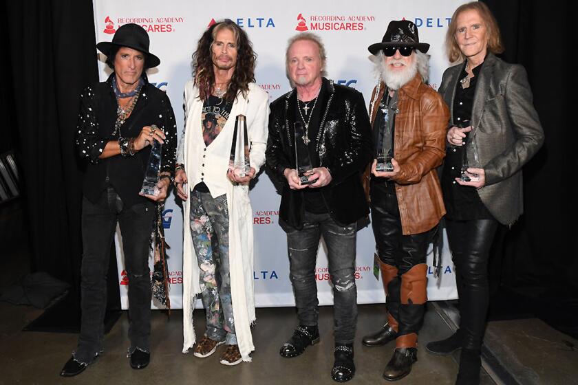 **ONE TIME USE FOR CALENDAR 12/272020 and WEB STORY- LOS ANGELES, CALIFORNIA - JANUARY 24: (L-R) Honorees Joe Perry, Steven Tyler, Joey Kramer, Brad Whitford, and Tom Hamilton of music group Aerosmith, recipients of the Person of the Year award, attends MusiCares Person of the Year honoring Aerosmith at West Hall at Los Angeles Convention Center on January 24, 2020 in Los Angeles, California. (Photo by Kevin Mazur/Getty Images for The Recording Academy)