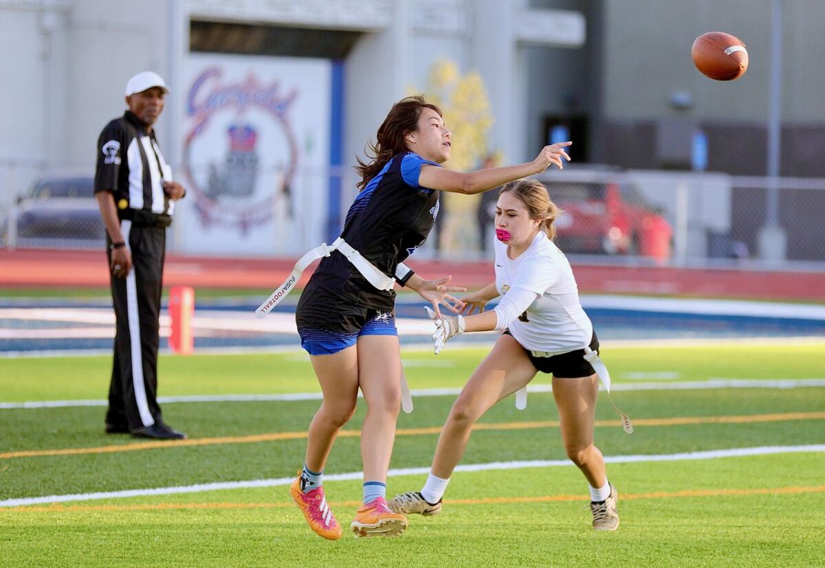 L.A. Marshall defeats Eagle Rock for Metropolis Part Open Division flag soccer title 4 Sun Valley Magnet quarterback Daisy Muniz throws the ball just before her flag is pulled by San Fernando rusher Kaylie Lowe