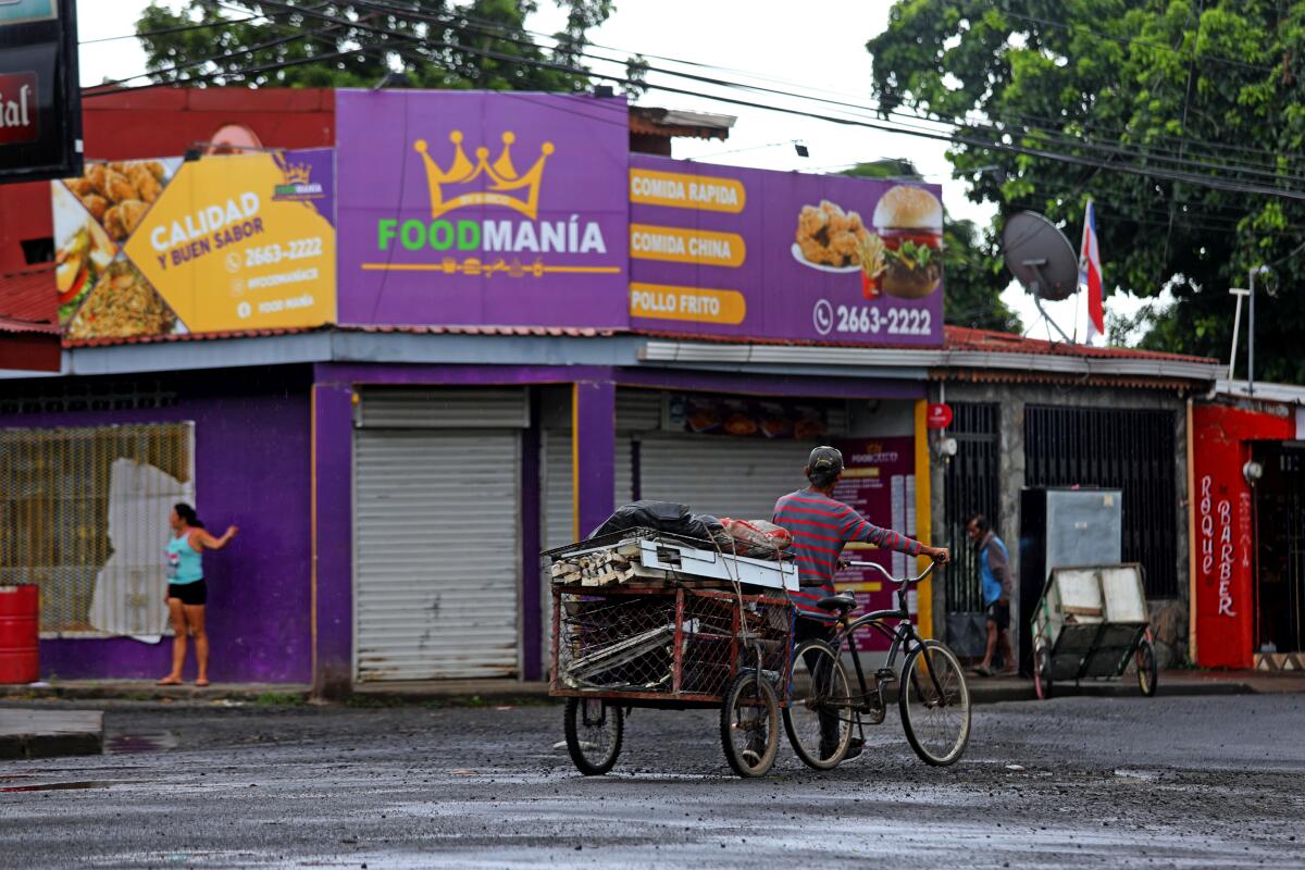 A bike peddles in front of the store where Kedwin Cordero Vega was shot and killed.