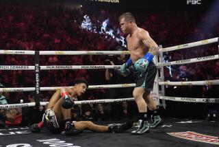 Canelo Alvarez knocks down Jaime Munguia in a super middleweight title fight Saturday.