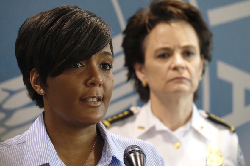 Inn this May 30, 2020, photo, Atlanta Mayor Keisha Lance Bottoms announces a 9 p.m. curfew as protests continue over the death of George Floyd. As the coronavirus and protests against police brutality have swept the nation, black female mayors including Atlanta's Keisha Lance Bottoms and Chicago's Lori Lightfoot have led the charge. (Ben Gray/Atlanta Journal-Constitution via AP)