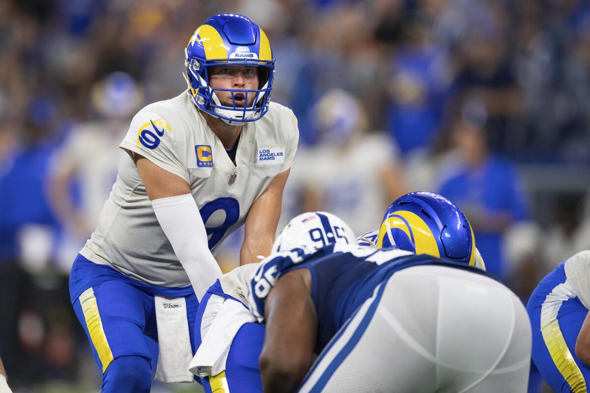 Rams quarterback Matthew Stafford readies to take a snap against the Colts.