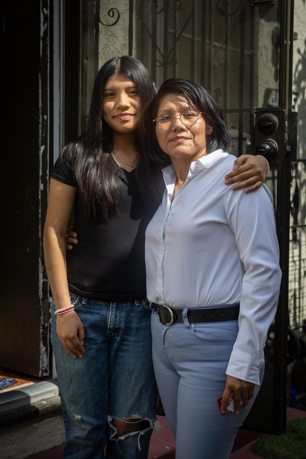 Yaretzi Perez, 14, stands with her arm around mother Eleuteria Perez