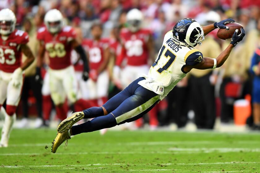 Rams wide receiver Robert Woods makes a catch against the Cardinals during the second quarter.