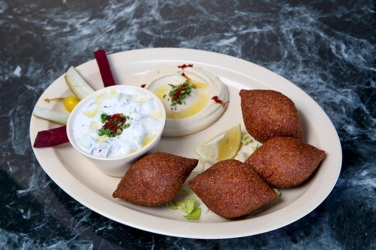 Fried kobee, hummus and yogurt with cucumber at the Kobee Factory & Syrian Kitchen.