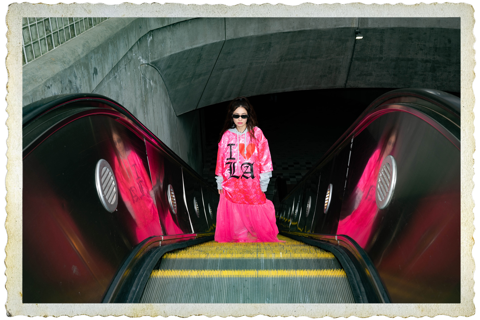 Vally Campbell going up an escalator.