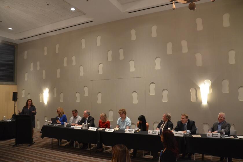 Nine of the 10 Huntington Beach City Council candidates participate in a forum presented by the Downtown Huntington Beach Business Improvement District on Wednesday at the Shorebreak Hotel.