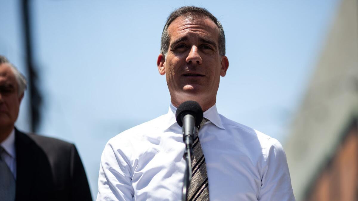 Los Angeles Mayor Eric Garcetti speaks to reporters during a news conference on June 6.