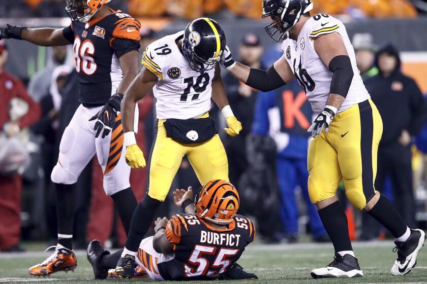 CINCINNATI, OH - DECEMBER 04: JuJu Smith-Schuster #19 of the Pittsburgh Steelers stands over Vontaze Burfict #55 of the Cincinnati Bengals after a hit during the second half at Paul Brown Stadium on December 4, 2017 in Cincinnati, Ohio. (Photo by Andy Lyons/Getty Images) ** OUTS - ELSENT, FPG, CM - OUTS * NM, PH, VA if sourced by CT, LA or MoD **