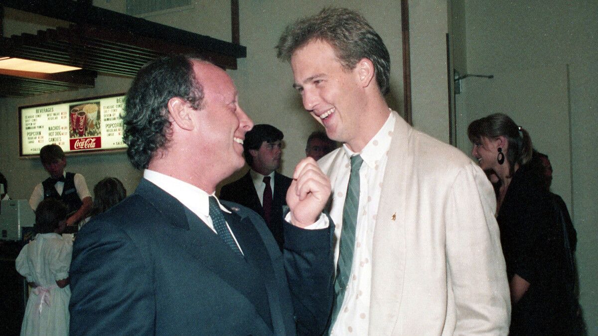 Director Tony Scott shares a laugh with actor Anthony Edwards at the benefit West Coast premiere of the movie "Top Gun" at Mann's Cinema 21 in Mission Valley on May 15, 1986. (Photo by Bob Redding/The San Diego Union-Tribune) User Upload Caption: U-T file photos at the West Coast premiere of the movie "Top Gun" at Mann's Cinema 21 in Mission Valley on May 15, 1986.