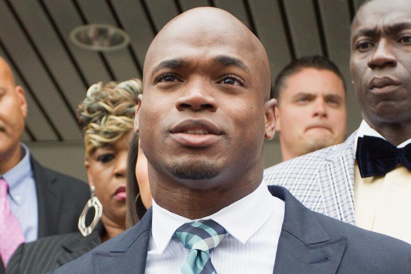 Minnesota Vikings running back Adrian Peterson speaks to the media after pleading no contest to misdemeanor reckless assault charges in Texas on Nov. 4.