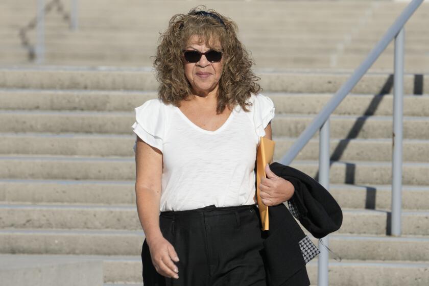 Nancy Marks leaves federal court, Thursday, Oct. 5, 2023, in Central Islip, N.Y. Marks, the ex-campaign treasurer for U.S. Rep. George Santos pleaded guilty Thursday to conspiring to defraud the U.S. government and implicated the indicted New York Republican in court with submitting bogus campaign finance reports. (AP Photo/Mary Altaffer)