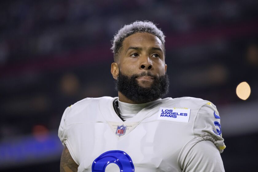 FILE - Los Angeles Rams wide receiver Odell Beckham Jr. stands for the national anthem before the team's NFL football game against the Arizona Cardinals on Dec. 13, 2021, in Glendale, Ariz. Beckham will kick off what is anticipated to be a three-city free agency tour when he meets Thursday, Dec. 1, with the New York Giants, the team that drafted him in 2014. Beckham is expected to talk with coach Brian Daboll and general manager Joe Schoen. Team surgeons also are expected to examine his left knee. (AP Photo/Jeff Lewis, File)