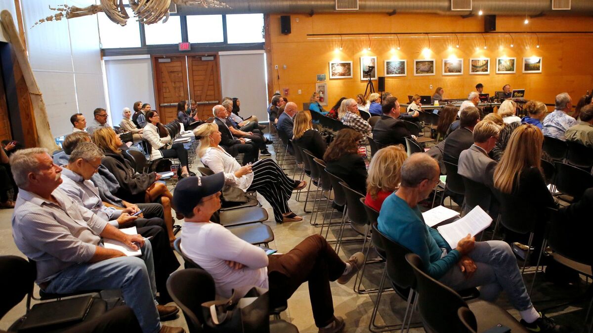 A crowd listens as the California Coastal Commission hears comments about Laguna Beach's proposed revisions to short-term lodging rules Thursday.