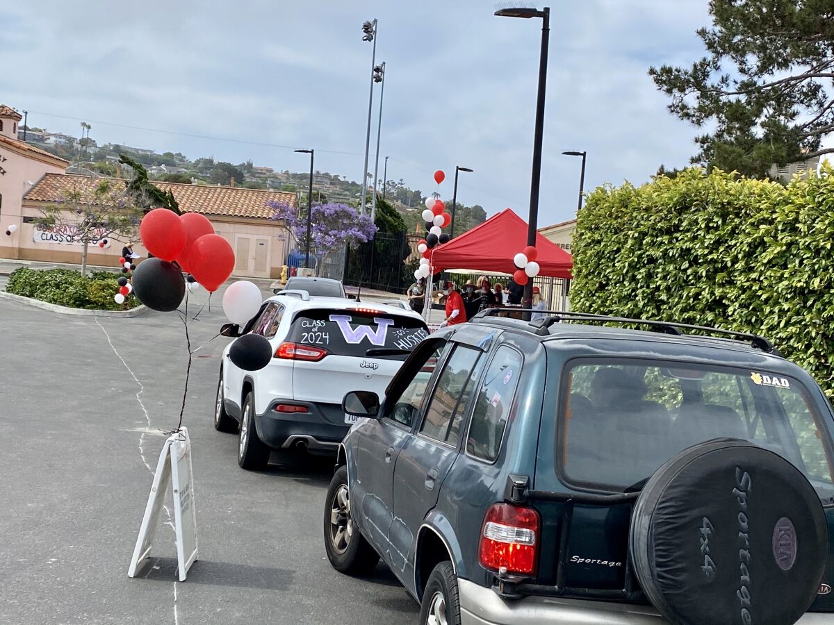 La Jolla High seniors participate in a drive-through celebration June 2 in place of a traditional commencement ceremony.