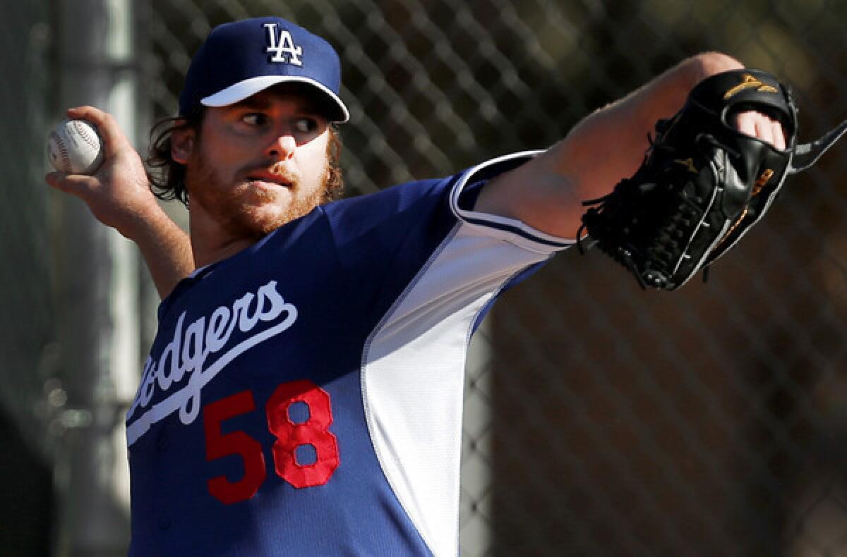 Dodgers pitcher Chad Billingsley throws during a spring training workout last month in Glendale, Ariz.