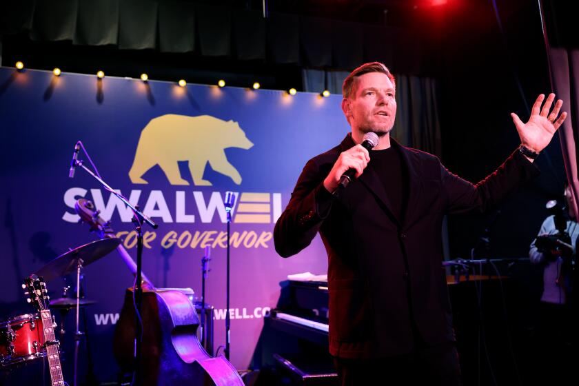 BERKELEY, CA, FEBRUARY 20, 2026: Candidate for Governor of California, Rep. Eric Swalwell, addresses his crowd of supporters at Local Edition bar in San Francisco during the California Democratic Party 2026 State Convention on Friday, February 20, 2026.(Christina House / Los Angeles Times)
