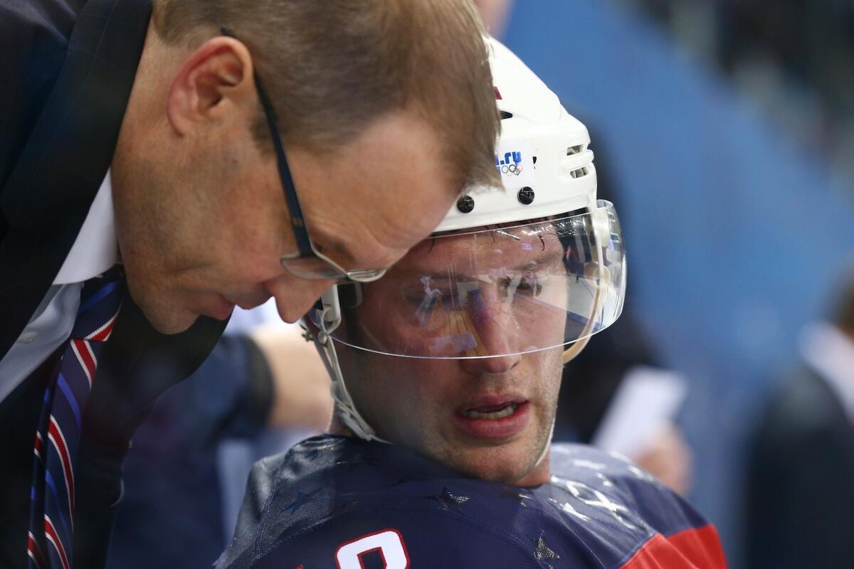 Coach Dan Bylsma talks with Blake Wheeler on the bench during the United States' quarterfinal win Wednesday over the Czech Republic, 5-2. The U.S. will face Canada in the semifinals Friday.