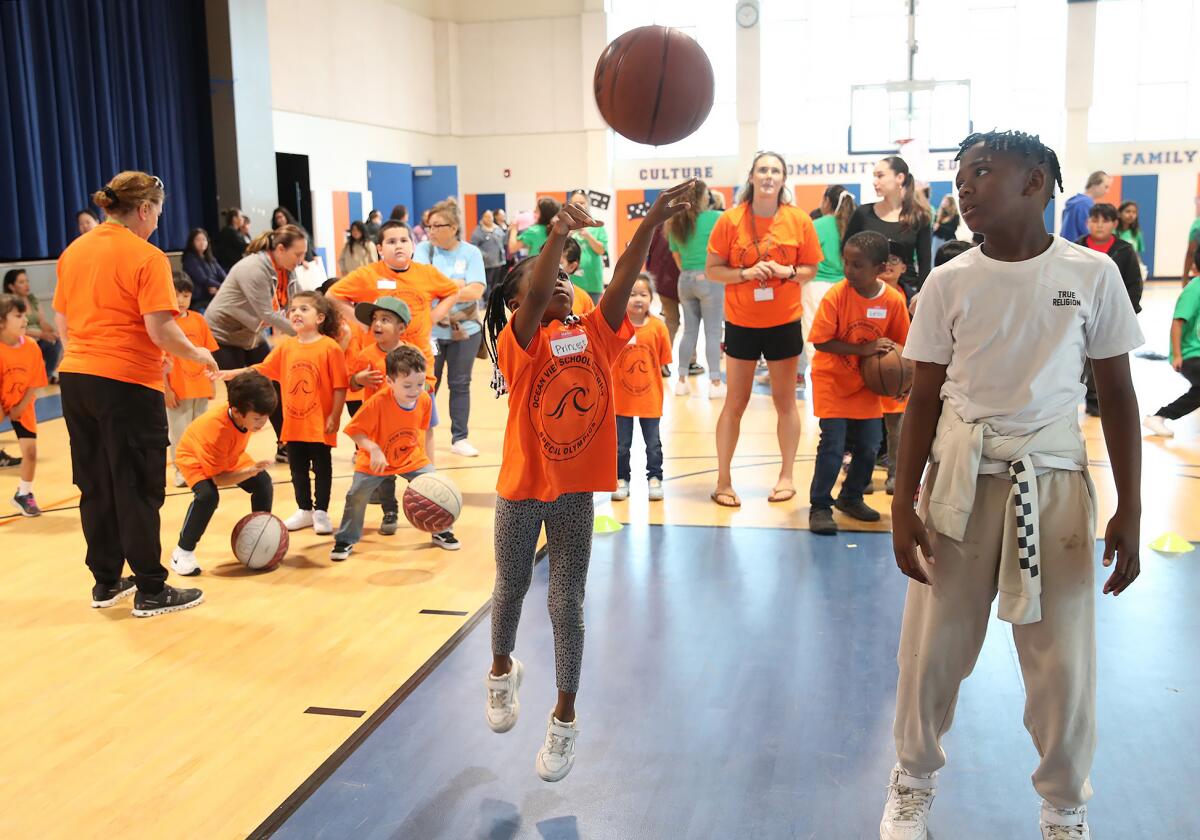 Princess Joe from Westmont School puts up a shot in the free-throw basketball event.