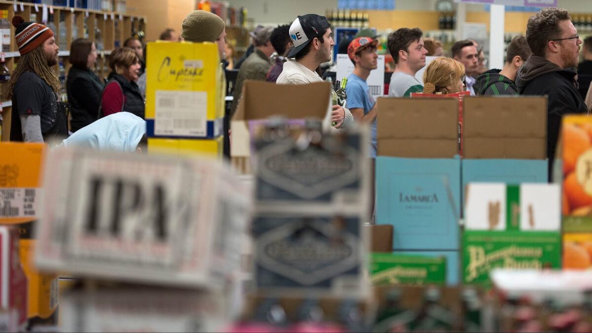 Shoppers at the Sugarhouse State Liquor store in Salt Lake City. Utah now has the lowest blood-alcohol concentration limit for drivers in the country.