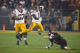 Southern California wide receiver Zachariah Branch (1) leaps over Arizona State.