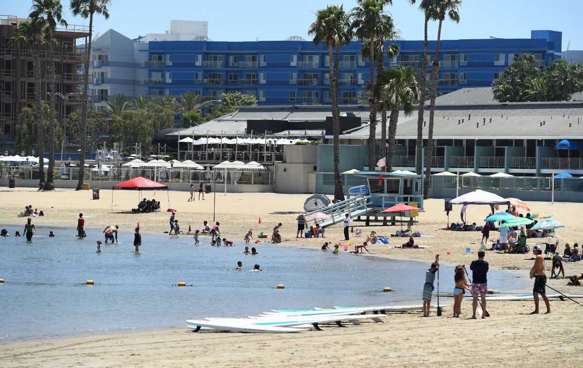 Image of families swimming and playing at Mother's Beach in Marina del Rey