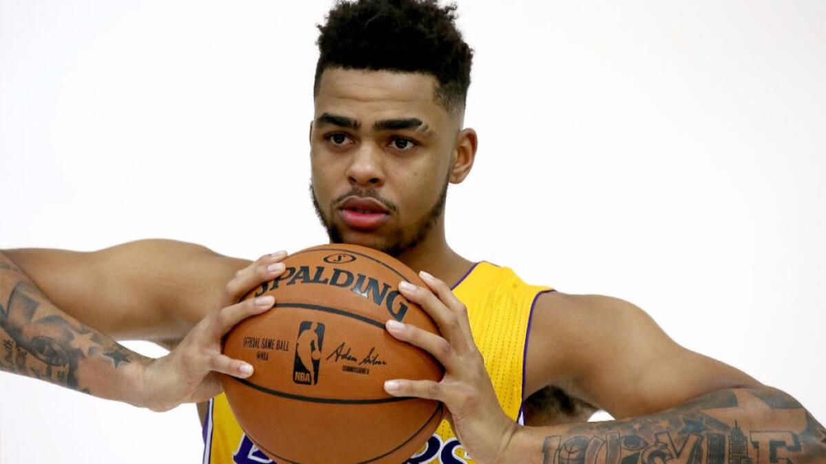 Lakers guard D'Angelo Russell poses for photographs during media day on Sept. 26. (Luis Sinco / Los Angeles Times)