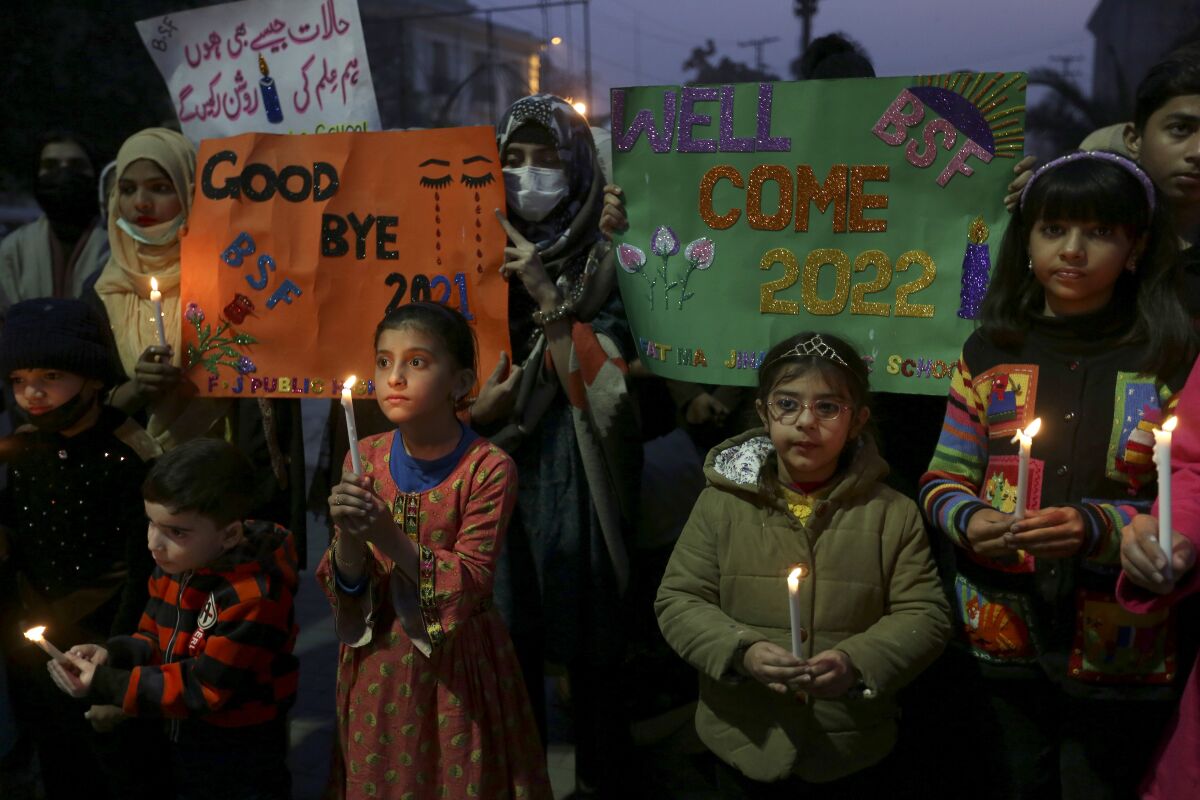 Students hold candles in Lahore, Pakistan.