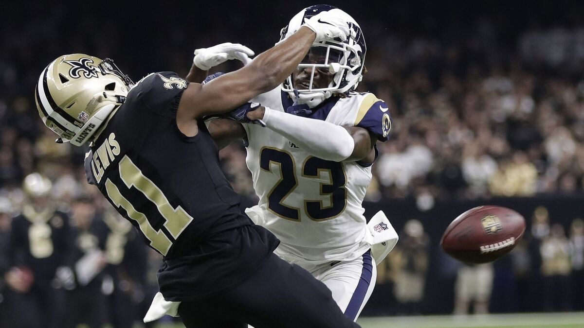 Rams defensive back Nickell Robey-Coleman breaks up a pass intended for Saints receiver Tommylee Lewis, albeit before the ball arrived.