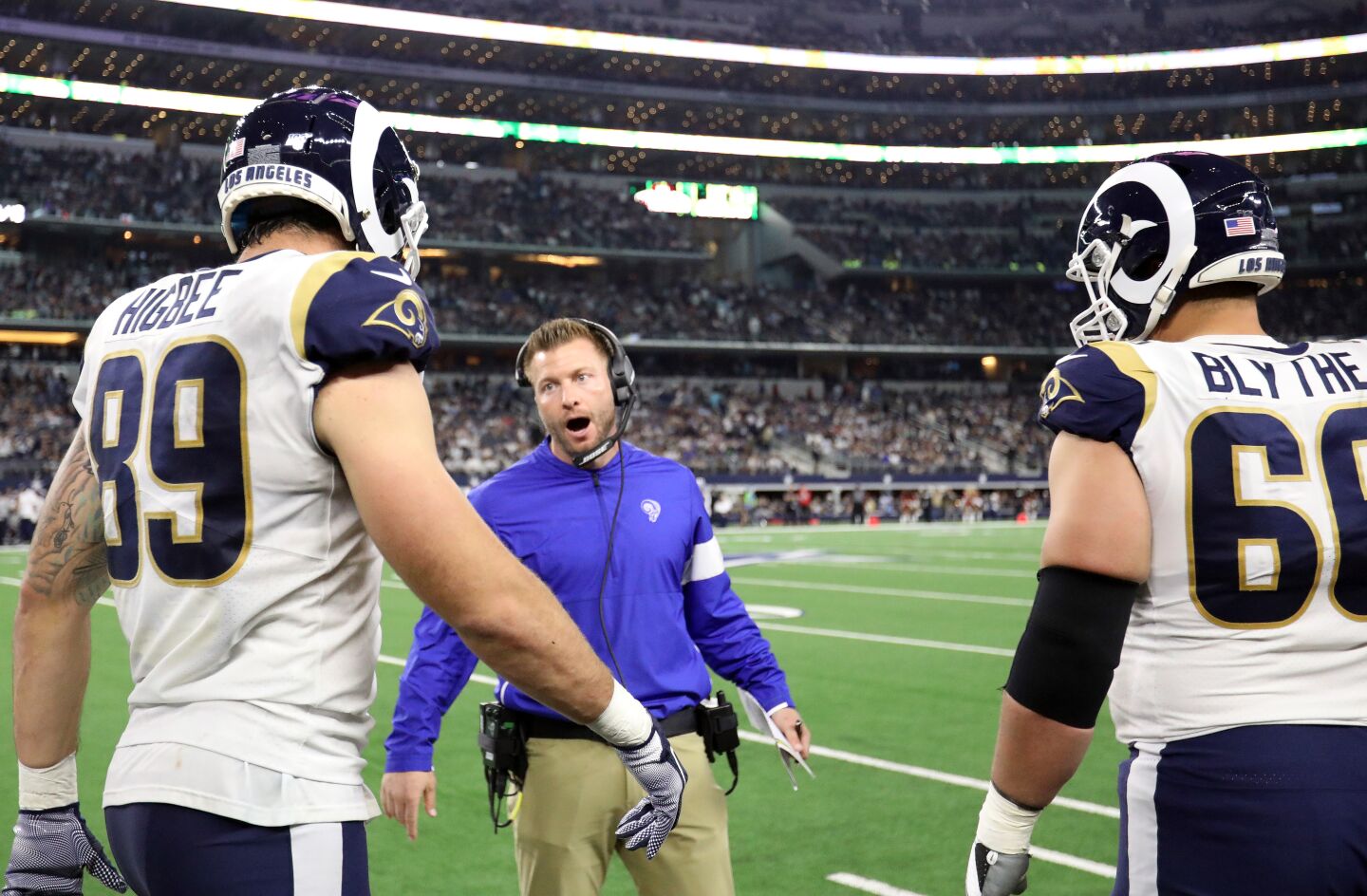 Rams coach Sean McVay speaks with tight end Tyler Higbee (89) and center Austin Blythe during the second half of a 44-21 loss to the Dallas Cowboys.