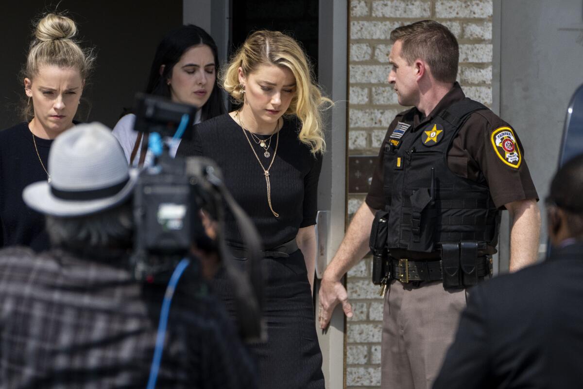 Amber Heard walks out of the courthouse.