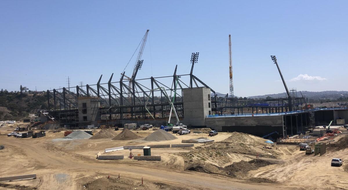 Aztec Stadium view looking east gives another glimpse of steel beams, as well as three (of 12) light standards.