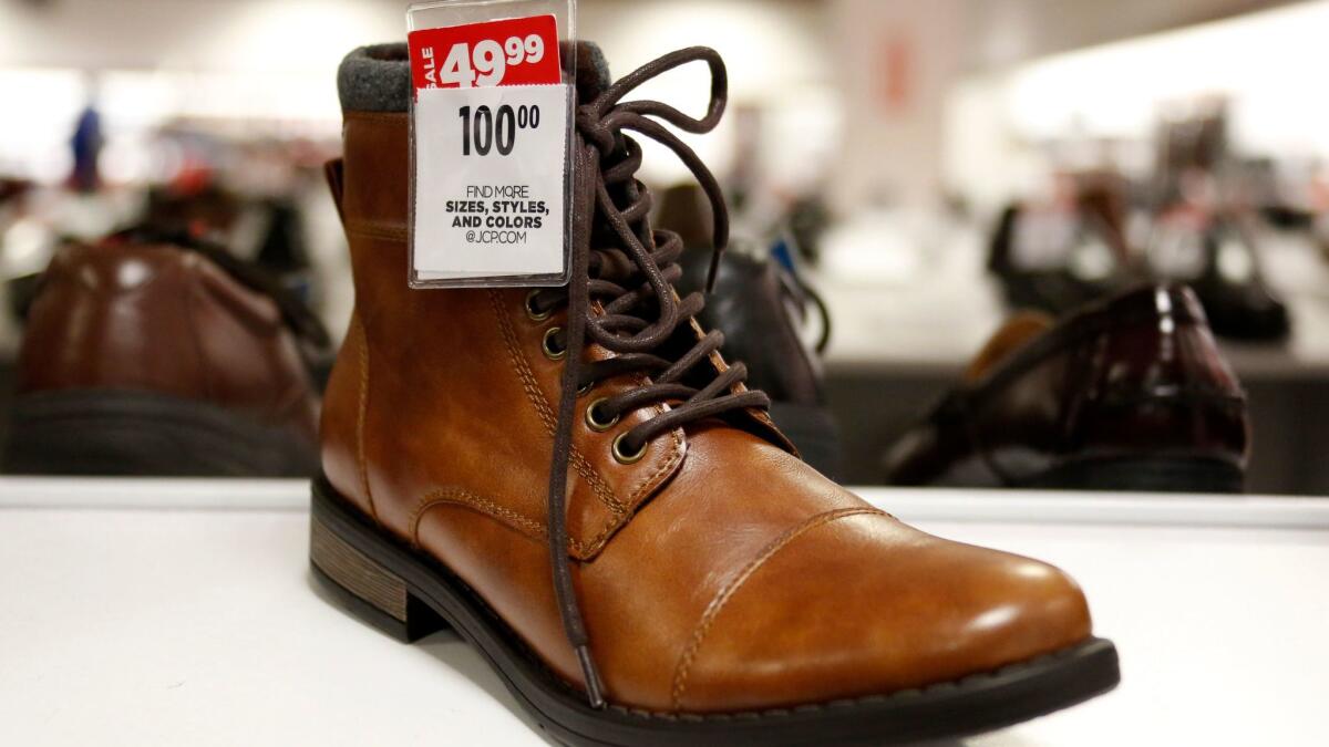 This Feb. 8 photo shows the sale price for a pair of men's boots at a J.C. Penney store in Pittsburgh. On Friday, the Labor Department reports on U.S. consumer prices for March.