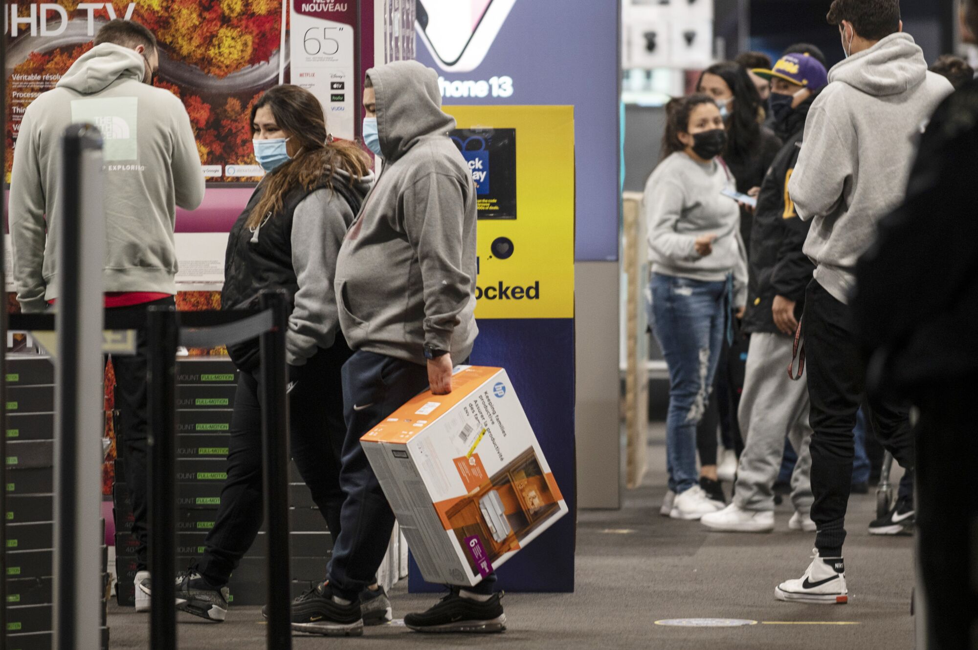 Shoppers look to score deals at 5 a.m.  at the Best Buy in Empire Center in Burbank.
