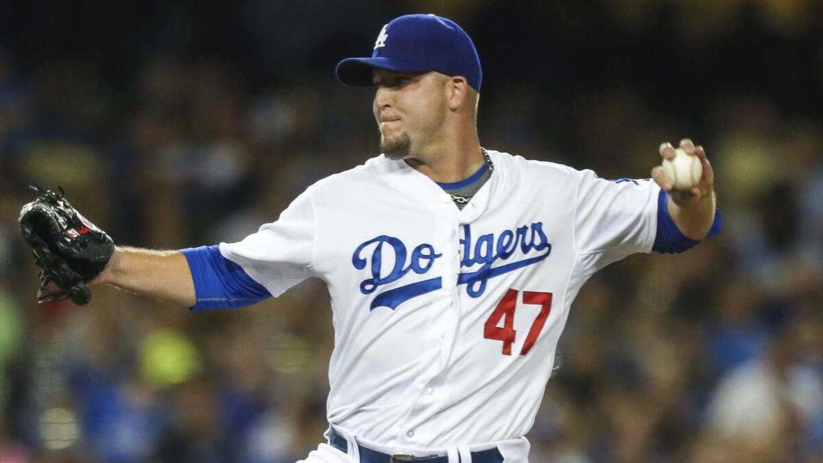 Dodgers pitcher Paul Maholm delivers during a game against the St. Louis Cardinals in June.