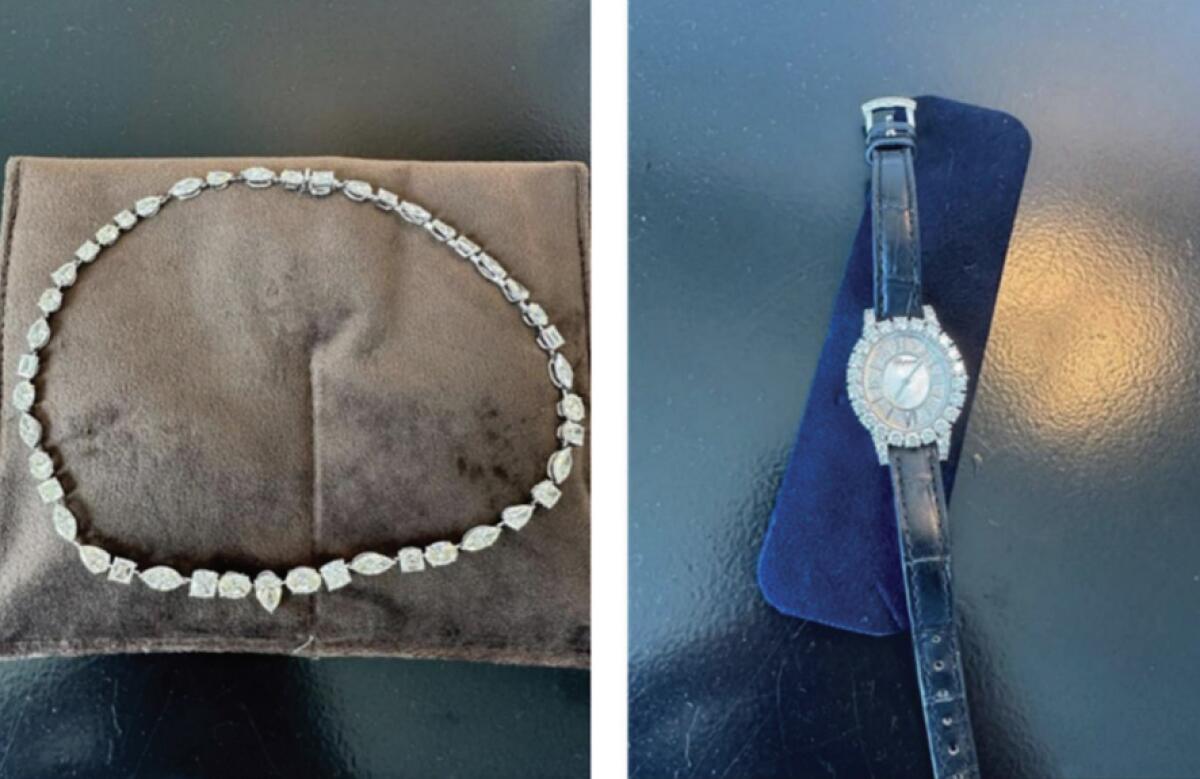 A diamond necklace and a watch with diamonds around its face