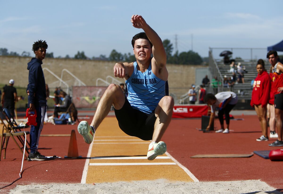 Corona del Mar's Jason Plumb competes in the boys' long jump at Mission Viejo High School on Saturday.