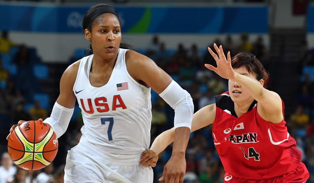 USA's forward Maya Moore works around Japan's forward Sanae Motokawa during a women's quarterfinal basketball game during the Rio Olympics on Tuesday.