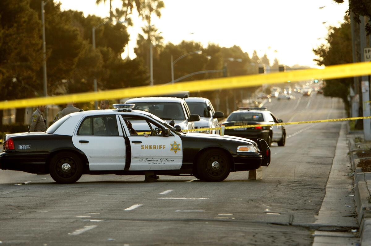 Sheriff deputies investigate a shooting near Hollywood Park in Inglewood on Tuesday, October 29, 2013.