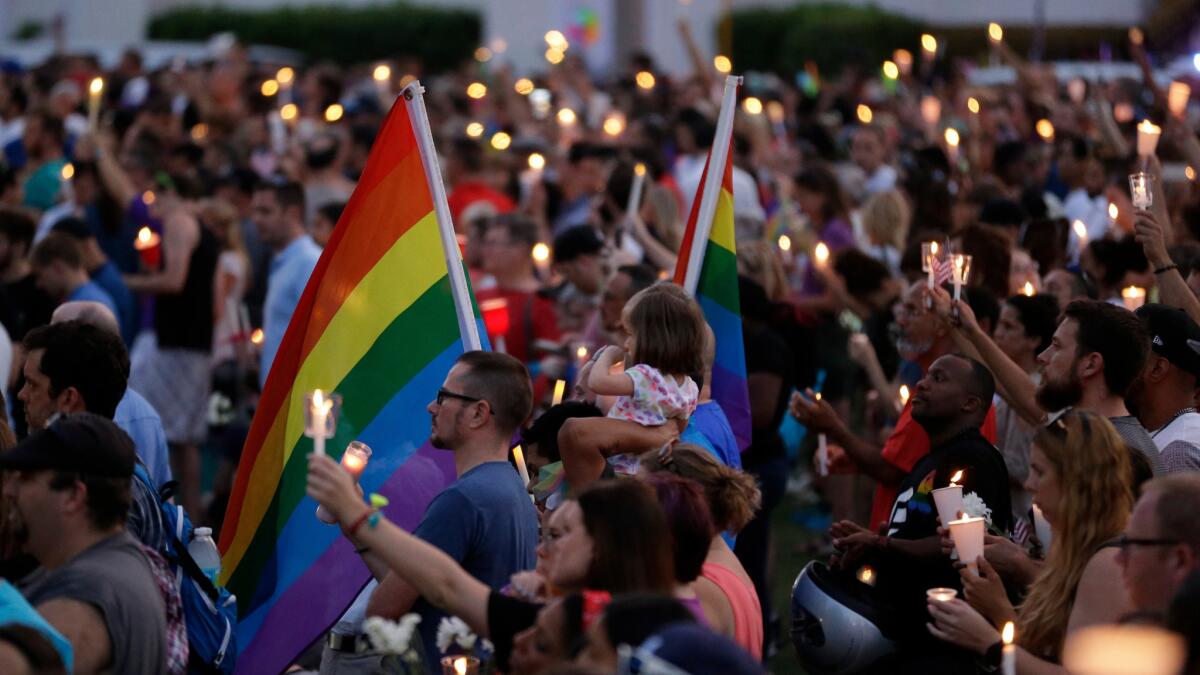 Mourners gather at Lake Eola Park in Orlando to honor the Pulse shooting victims.
