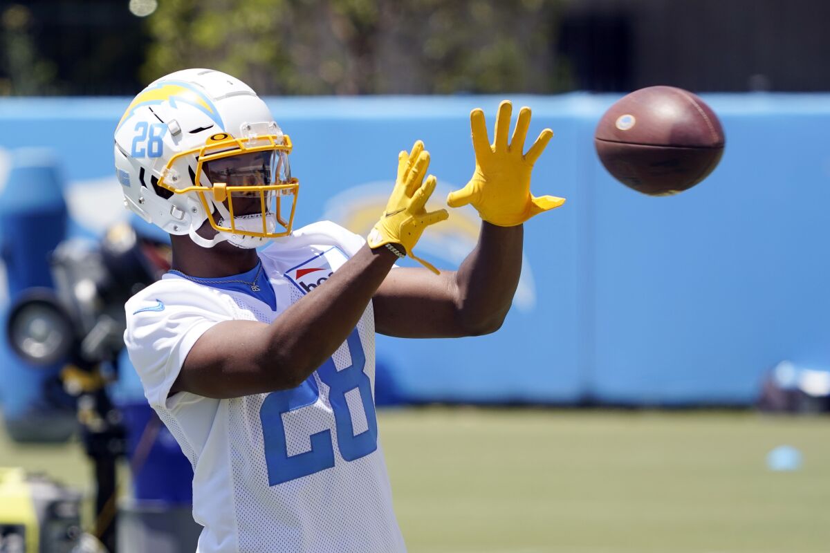 Los Angeles Chargers running back Isaiah Spiller makes a catch during an NFL football rookie minicamp, Friday, May 13, 2022, in Costa Mesa, Calif. (AP Photo/Marcio Jose Sanchez)