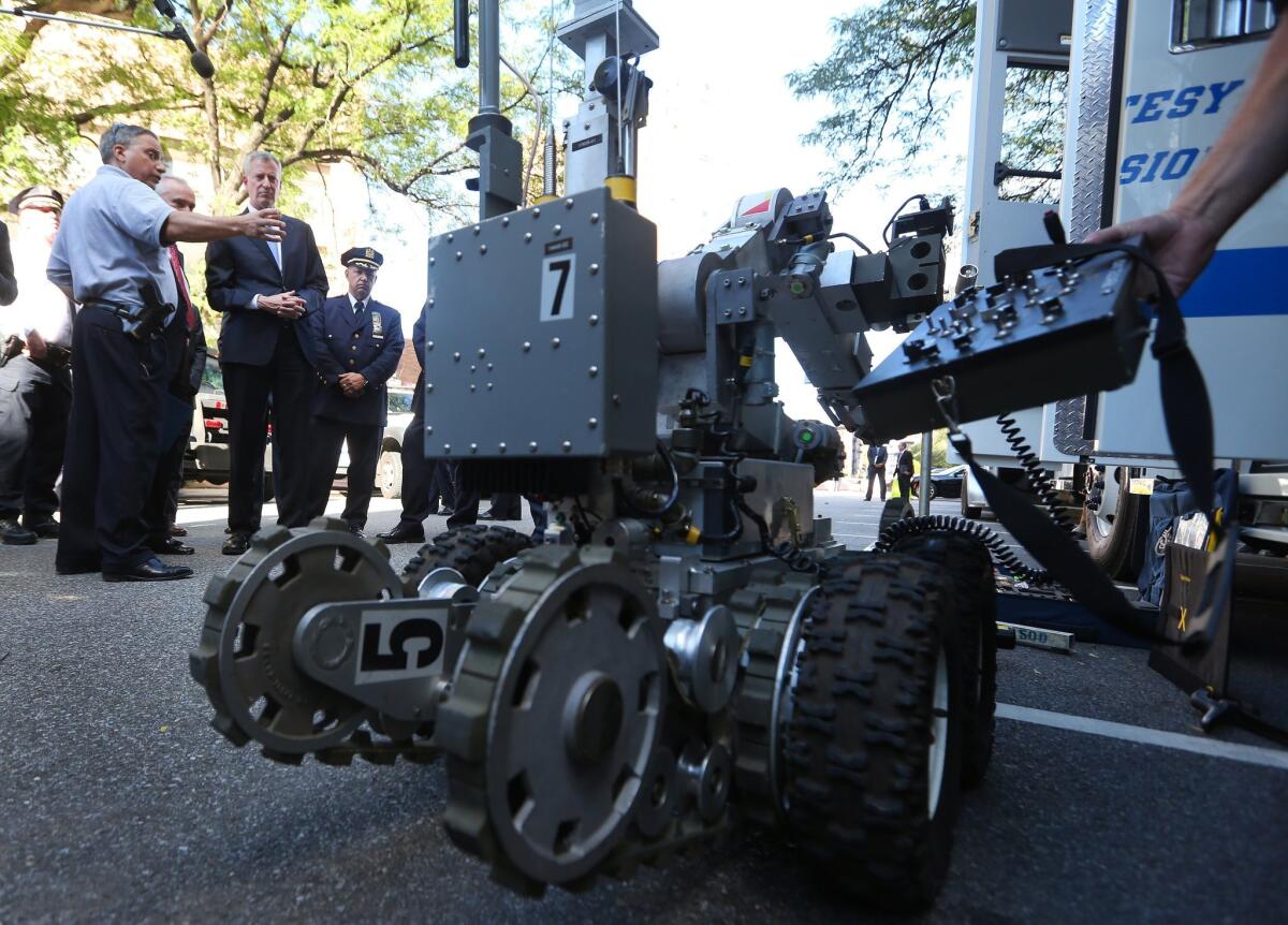 New York City Mayor Bill de Blasio and NYPD Commissioner William J. Bratton inspect special security equipment that will be available during next week's visit by Pope Francis. The city also will host 170 world leaders for the United Nations General Assembly and a free Beyonce concert in Central Park.
